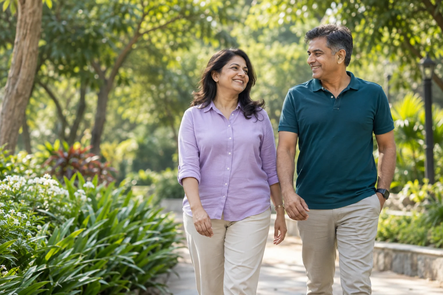 A couple enjoying a walk together in a sunlit park