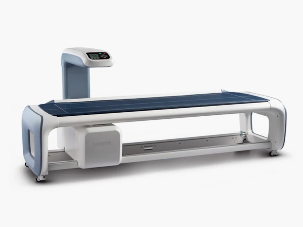 PRIMUS DXA scanner with an open padded table and scanning arm